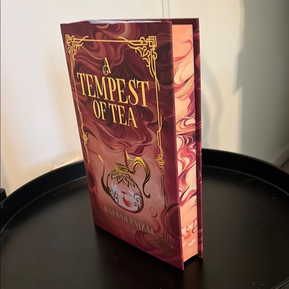 A Tempest of Tea by Hafsah Faizal - Maroon Hardcover